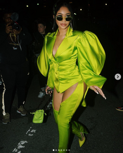 Saweetie wearing Gelareh Mizrahi Tortoise Chain Neon Green Bucket Bag during NYFW February 2020